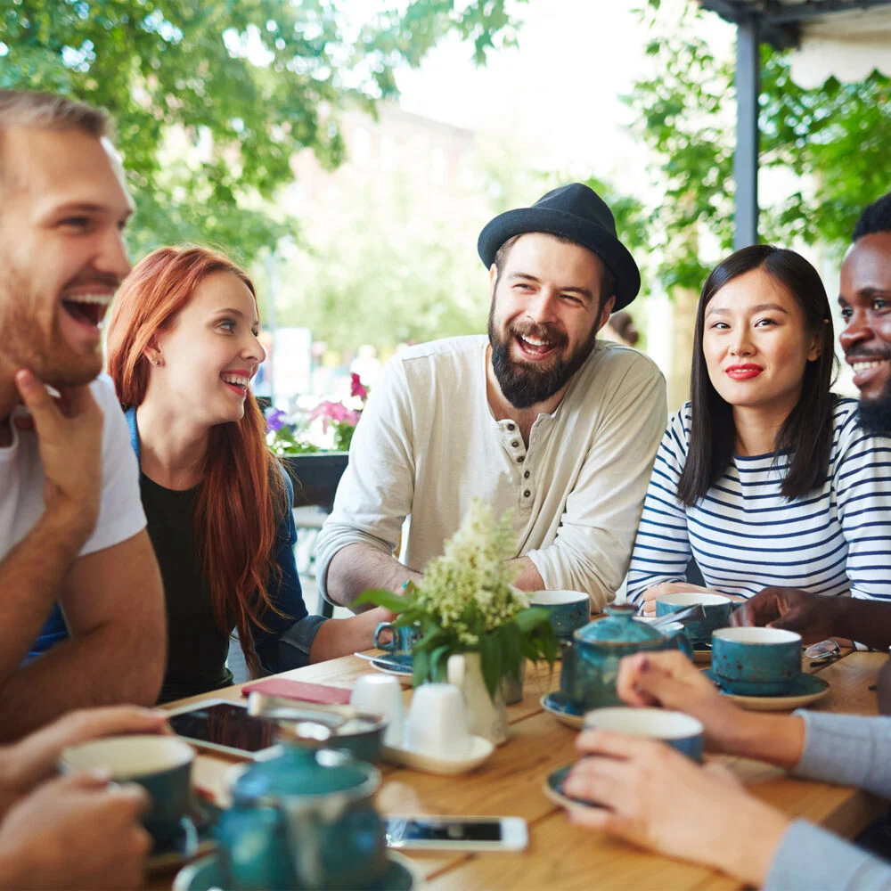 Adults laughing together in a church fellowship group