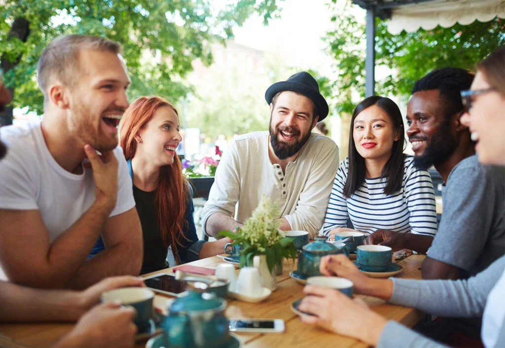 Adults laughing together in a church fellowship group