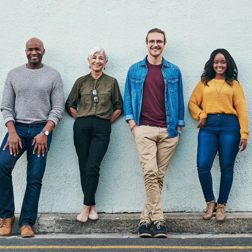 A group of church members standing together against a wall
