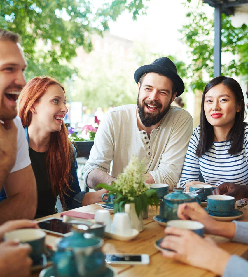 Friends talking around a table