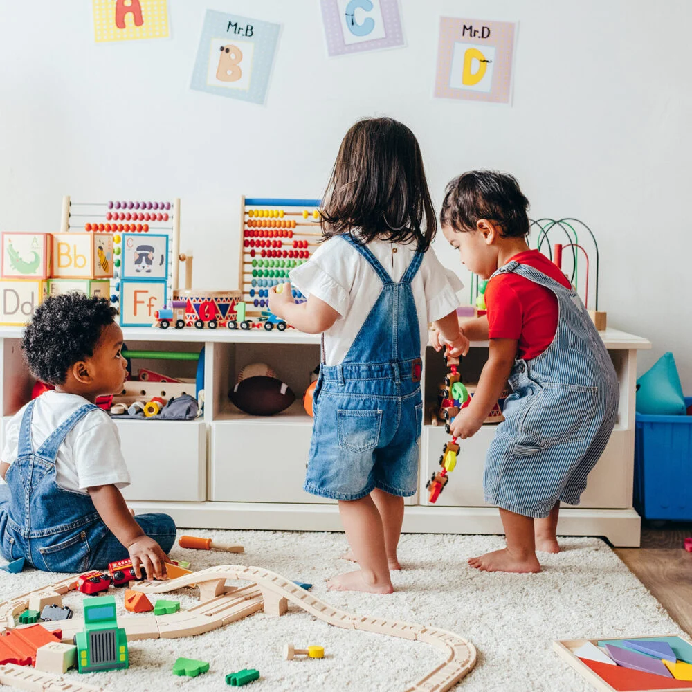 Two toddlers playing in the church kids playroom